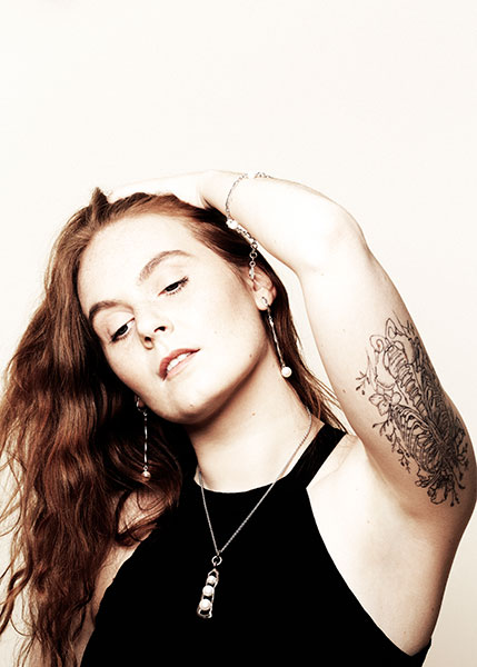 Red haired model with jewelry